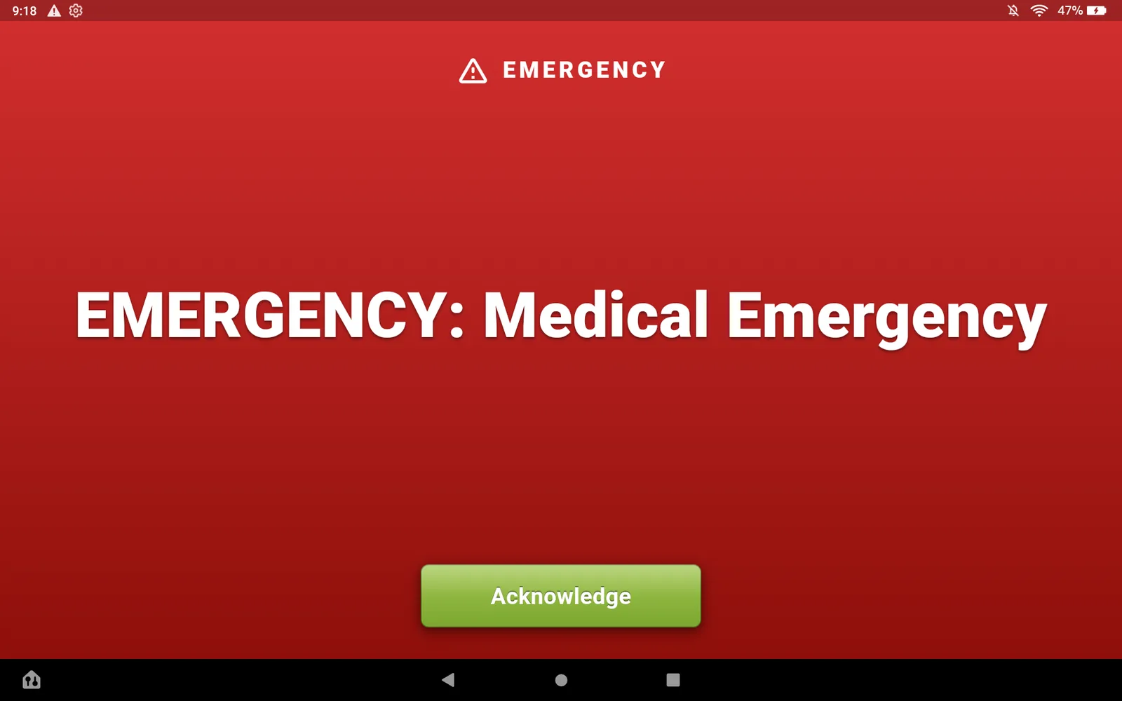The Op 1 tablet taken over by a red screen reading EMERGENCY: Medical Emergency, with an Acknowledge button.